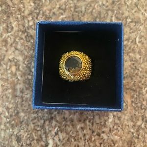 Gold ring with purple stone